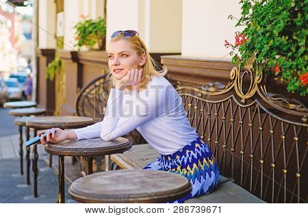 Whom Should I Call. Woman Curious Face Sit With Smartphone Cafe Terrace Urban Background. Lady Looki