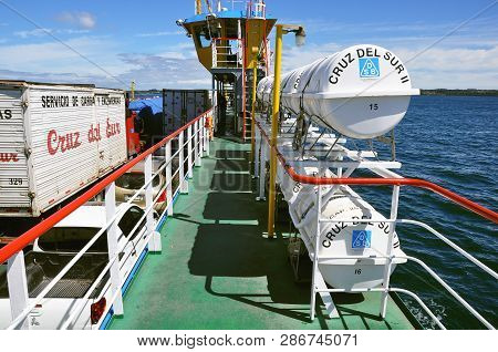 Chacao, Chile - February 06, 2013: Freight Trucks On The Ferry Moves To Chiloe Island.