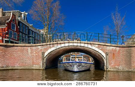 Amsterdam, Netherlands - March 26: Sightseeing Boat Tour On March 26, 2013 In Amsterdam