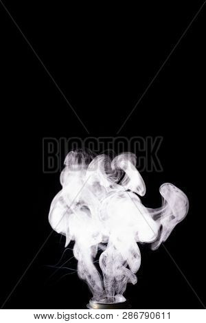 Splash Glicerine On Vape Spiral. White Thick Fog With Visible Tracers. Vape Culture And No Smoking. 
