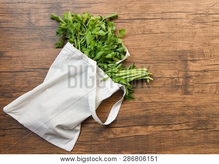 Zero Waste Use Less Plastic Concept / Fresh Vegetables Organic In Eco Cotton Fabric Bags On Wooden T