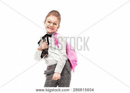 Back To School. Beautiful Little Girl Dressed Like A School Girl - White Shirt And Gray Pants, Round
