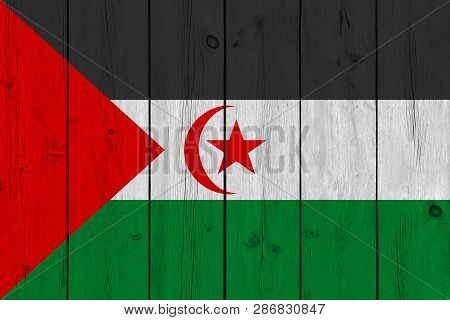 Sahrawi Arab Democratic Republic Flag Painted On Old Wood Plank. Patriotic Background. National Flag