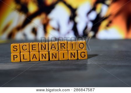 Scenario Planning On Wooden Blocks. Cross Processed Image With Bokeh Background