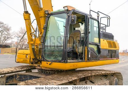 Empty Cab Of An Excavator With Soil On Grouser Pad