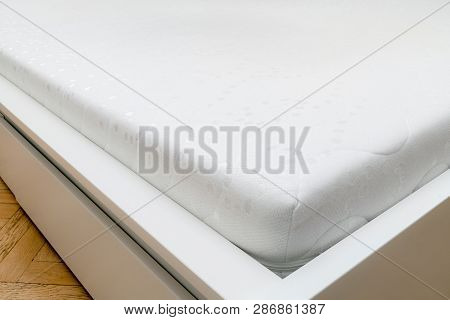 Close Up Of Memory Foam Mattress On The Bed Frame At Sleeping Room. Comfort, Choosing Mattress