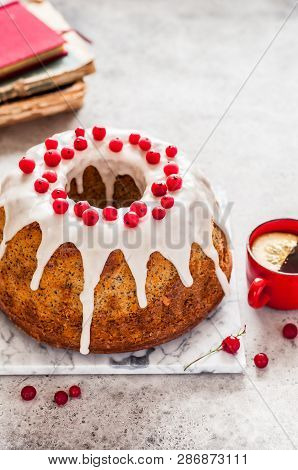 Lemon Poppy Seed Bundt Cake With Sugar Glaze And Redcurrant, Copy Space For Your Text