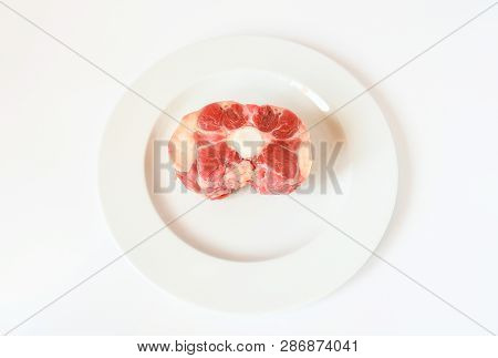 Fresh Cutting Raw Oxtail Or Beef With Bone, Tail Path Of Cow On White Plate And White Background. Ox
