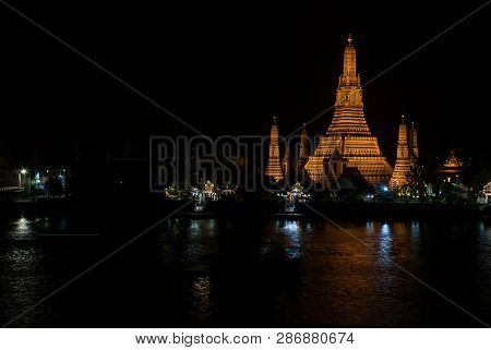 Wat Arun Historical Park And The Chao Phraya River At Night