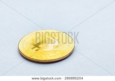 Golden Bitcoin On White Background. Concept Mining. Copyspace