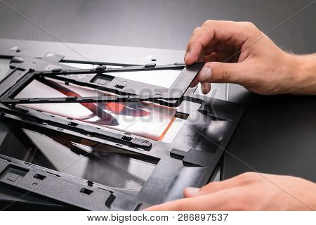 Professional Technician Hand Scanning Negative Film And Slides,