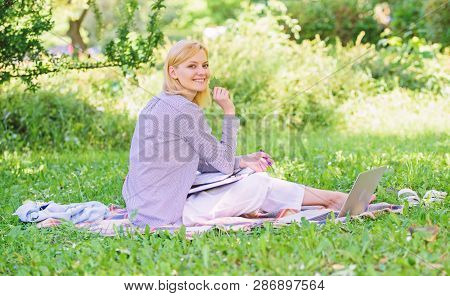Woman With Laptop Sit Grass Meadow. Best Jobs To Work Remotely. Business Lady Freelance Work Outdoor
