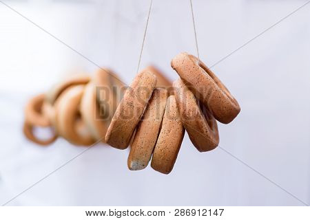 Ring-shaped Rolls In A Fare For Sale On White Background, Bagels, Bread Ring