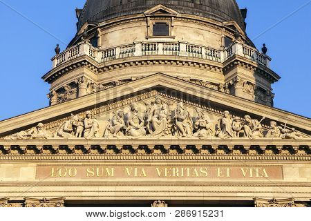 Fronton Of St. Stephens Basilica In Budapest, Hungary. The Text On The Facade Is Latin For -i Am The