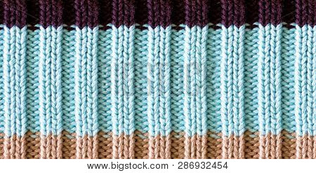 Texture Of Knitted Wool Fabric. Woolen Cloth. Striped Warm Knitting Sweater. Background For Wallpape