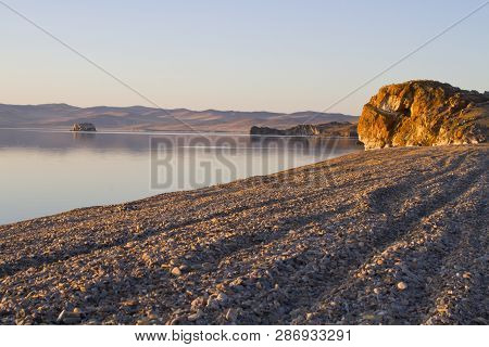 The Shore Of Lake Baikal From Small Stones At Cape Uyuga
