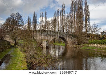 Old Bridge Above The City River, Arnoia, In The Medieval Town Of Allariz, Spain