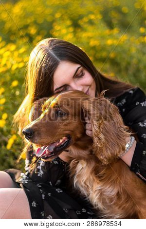 Nice Woman At Garden With A Dog, Enjoy The Life, Walks Outdoor. Happy Nice Natural Beauty Woman.