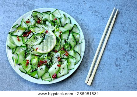 Cucumber Salad In Chinese Style. Salad With Cucumbers And Chili Pepper. Chinese Salad With Cucumber.