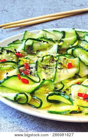 Cucumber Salad In Chinese Style. Salad With Cucumbers And Chili Pepper. Chinese Salad With Cucumber.