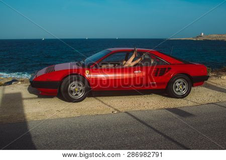 Legs Of Young Girl In The Window Of Ferrari