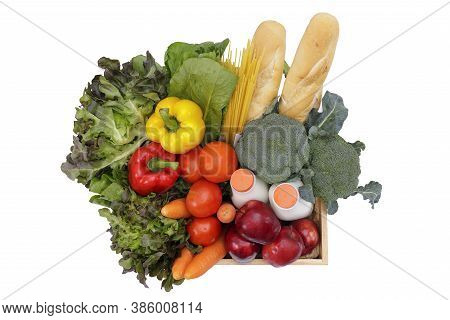 Top View Wooden Crate With Multi Color Vegetables , Fruit, Milk And Baguette Isolated On White Bakcg