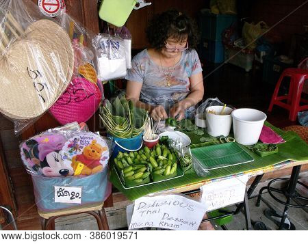 Amphawa, Thailand, January 23, 2016: A Woman Cooks A Thai Dessert At Amphawa Floating Market