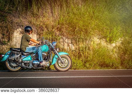 Motorcyle Ride On A Country Road At Dusk