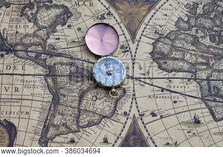 Classic Round Compass On Background Of Old Vintage Map Of World As Symbol Of Tourism With Map And Co