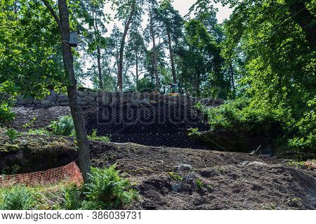 Selective Focus, Security Concept. Strengthening The Mountain Slope With Construction Equipment, Art
