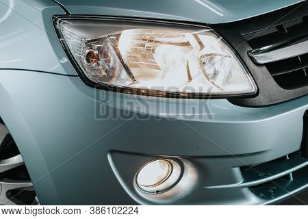 Novosibirsk, Russia - September 19, 2020: Lada Granta, Macro View Of Modern Blue Car Xenon Lamp Head