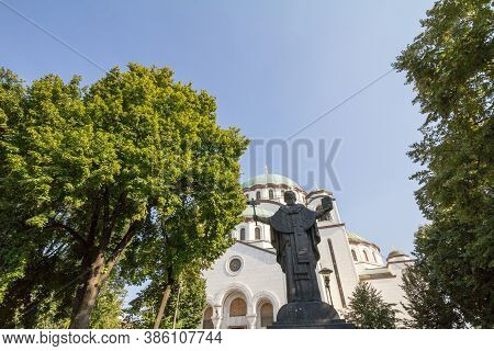 Saint Sava Cathedral Temple (hram Svetog Save) In The Afternoon And The Statue Dedicated To Sveti Sa
