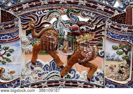 Hoi An, Vietnam, September 20, 2020: Dragon On The Colorful Decorated Wall In The Courtyard Of The V