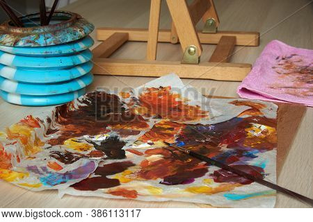 Paintbruses,  Acrylic Colour And Work Tools On The Table For Painting At Home
