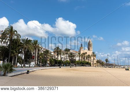 Empty Promenade Passeig De La Ribera With The Views Of Church Sant Bartomeu Y Santa Tecla, Sitges, C