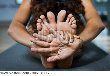 Seated Forward Bend Pose Yoga Iyengar, Paschimottanasana Front View In Studio