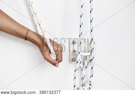 Closeup Hands Holding The Rope, Iyengar Yoga At Studio, White Wall