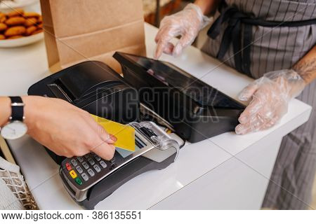 Hand Making A Purchaise, Paying With Her Credit Card
