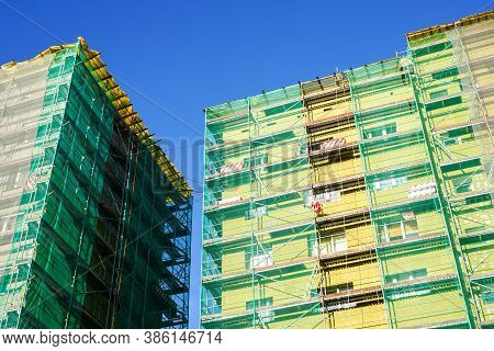 Scaffolding Arround The House To Install Thermal Insulation Of The Apartment Building Facade