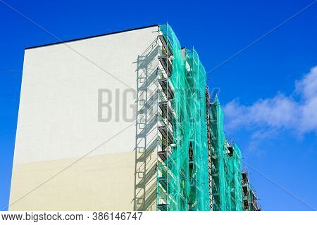 Scaffolding Arround The House To Install Thermal Insulation Of The Apartment Building Facade