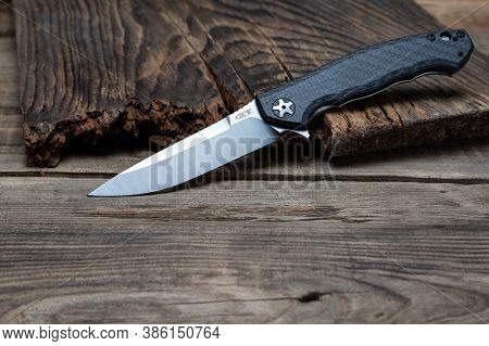 Kyiv, Ukraine - Dec 11,2020: Zero Tolerance 0452cf Sinkevich Knife On Wood Background.