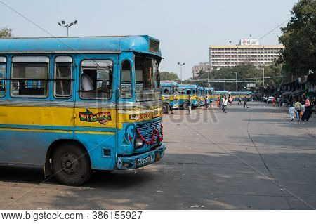 Kolkata, India - February 1, 2020: Several Unidentified People Walks Past Several Traditional Turquo