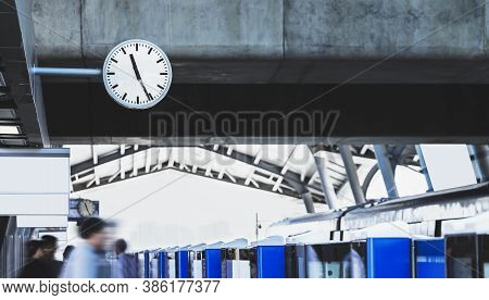 Public Clock In Railway Station At The Hanging With Roof Of Subway Central Train Station. It Is Cloc