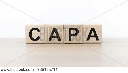 Word Capa. Wooden Small Cubes With Letters Isolated On Table With Copy Space Available