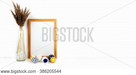 Empty Frame Mockup With Copy Space, Modern Golden, Blue And White Easter Eggs, Trendy Dry Flowers In