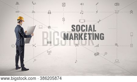 Engineer working on a new social media platform with SOCIAL MARKETING inscription concept