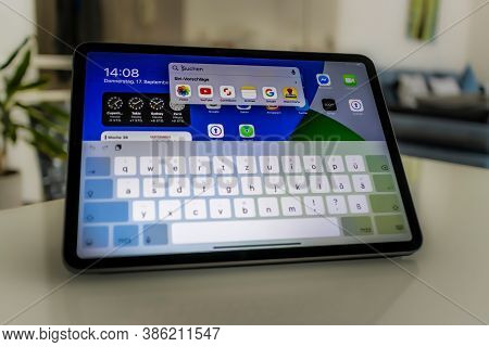 Frankfurt, Germany - September 17th 2020: A German Photographer Installing The All New Ipados 14 Sof