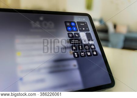 Frankfurt, Germany - September 17th 2020: A German Photographer Installing The All New Ipados 14 Sof