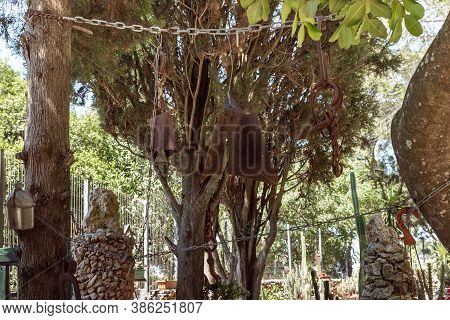 Daliyat Al-karmel, Israel, July 17, 2020 : Antique Tools Hang As Decorations On A Tree In The Garden