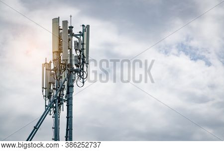 Telecommunication Tower With White Cloudy Sky. Antenna. Radio And Satellite Pole. Communication Tech